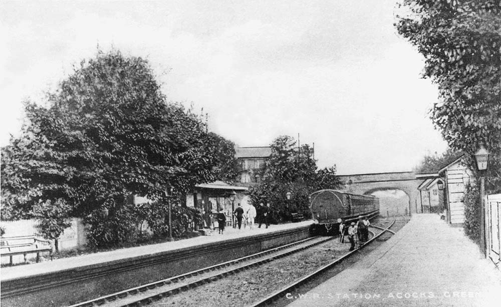 An Edwardian view of Acocks Green station looking towards Birmingham as a local passenger service departs from the down platform