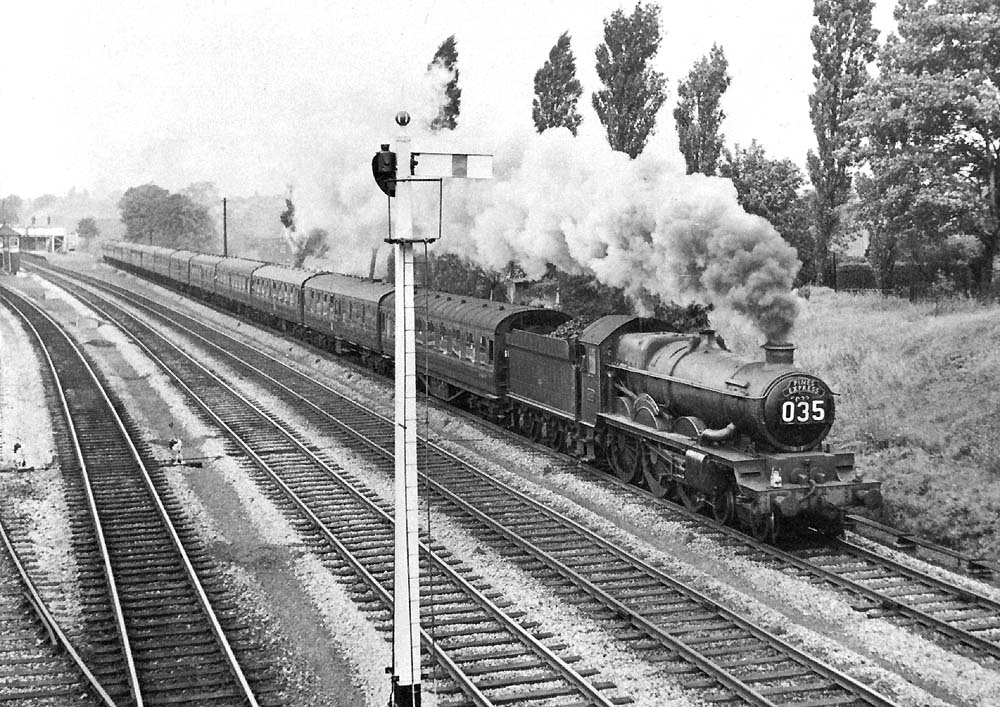 Ex-GWR 4-6-0 4073 Class No 5033 'Broughton Castle' passes south with the diverted Pines Express on 10th September 1962