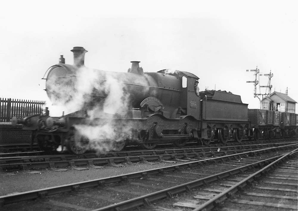 GWR 4-4-0 No 3314 'Mersey' a Bulldog class locomotive is seen here on an up goods train leaving Bearley