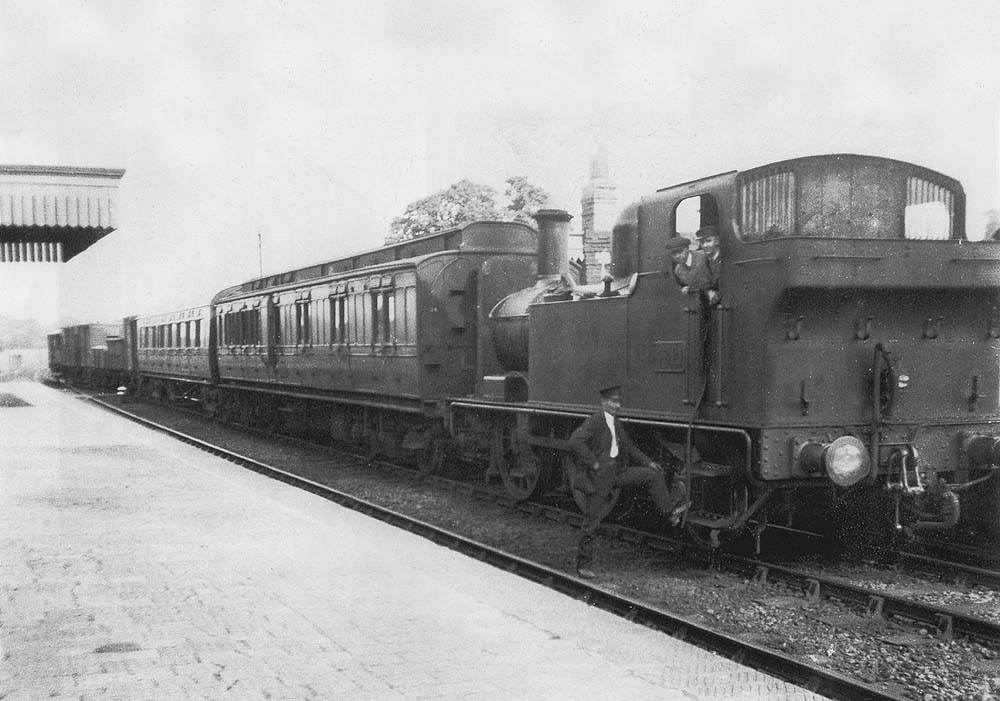 A Collett 48xx class 0-4-2T No 4814 with a Stratford Mop Special mixed train can be seen waiting at Bearley