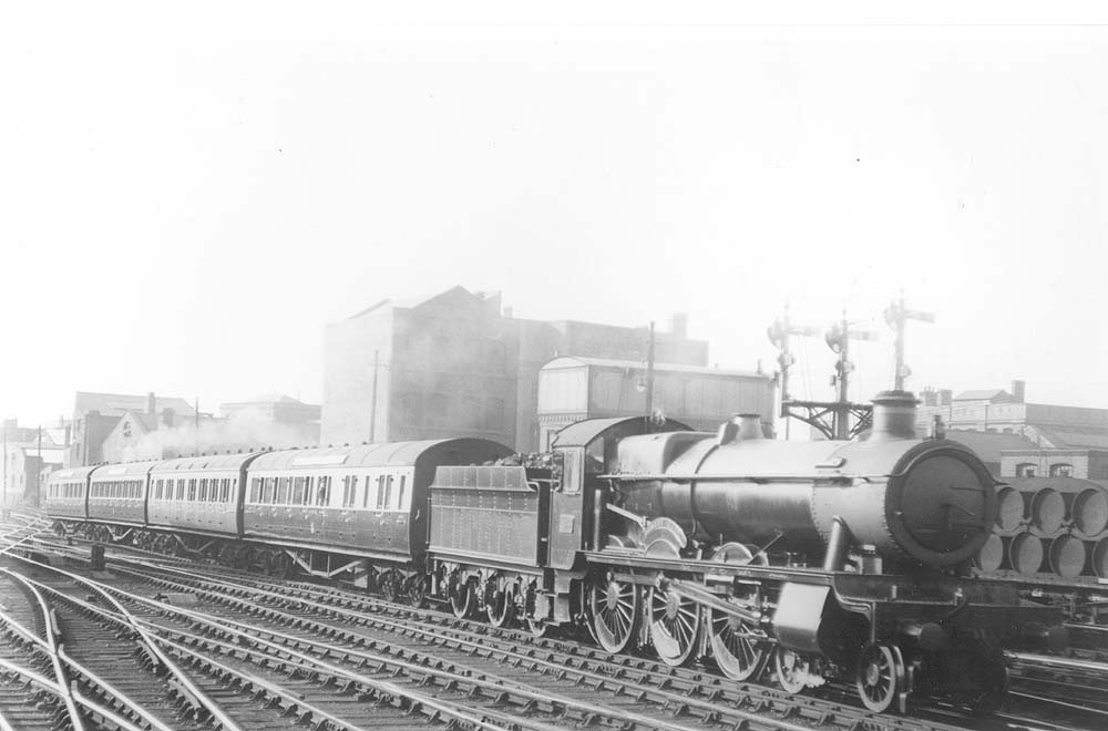 GWR 4-6-0 Hall class No 4936 'Kinlet Hall' is seen on an up express service to Paddington as it enters Snow Hill station circa 1929