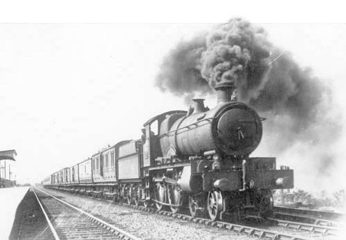 An unknown GWR 4-4-0 'County' class locomotive seen at the head of an up train in 1920s