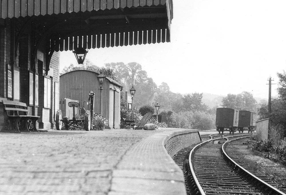 Close up showing Great Alne station with its goods shed on the platform and siding in the background