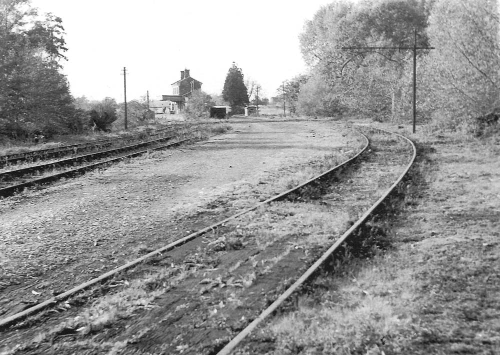 View looking towards Alcester showing Great Alne's overgrown goods yard and disused station in 1949