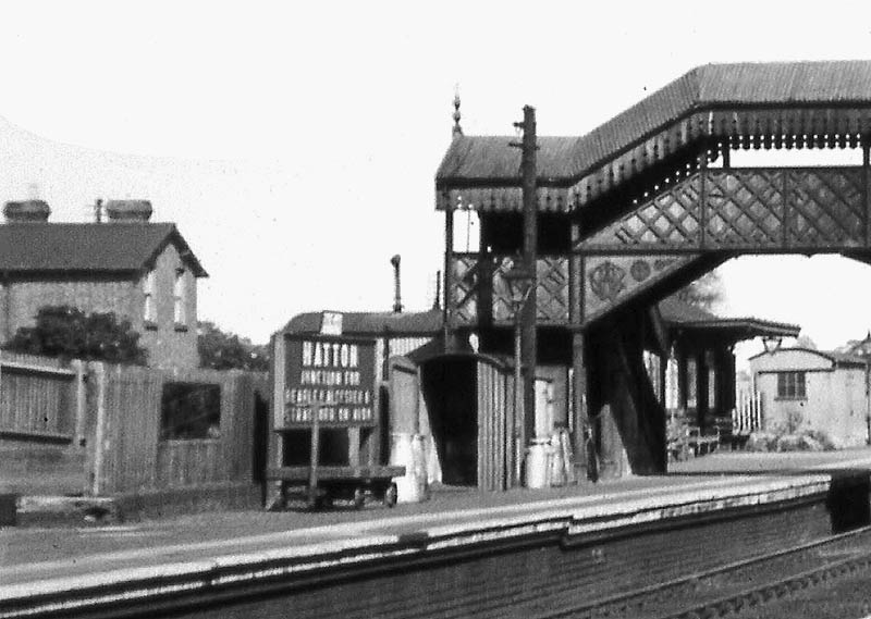 Close up showing the up platform and station sign declaring 'Hatton Junction for Bearley Alcester & Stratford upon Avon'