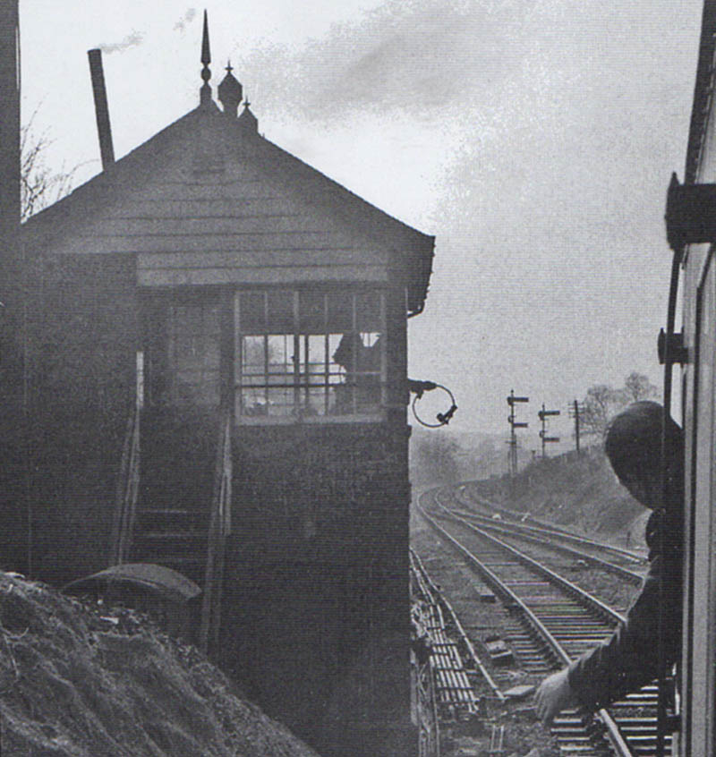 A DMU driver on a service to Stratford on Avon is about to exchange the token with the signalman from Hatton West Signal Box
