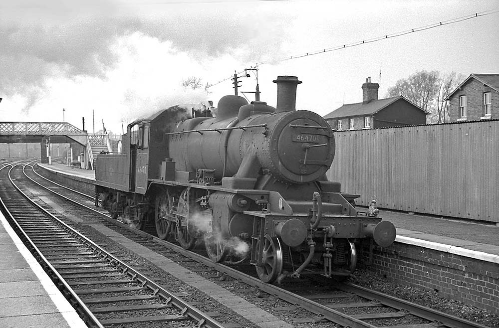 British Railways built 2-6-0 2MT No 46470 runs light engine through Hatton station on 20th April 1965