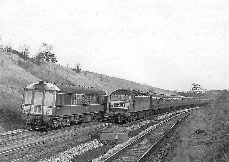 A single car DMU is seen on the 1:45pm Worcester to Stratford on Avon service as it passes the 1:10pm Paddington to Chester service headed by Brush Type 4 D1756 on 19th February 1966