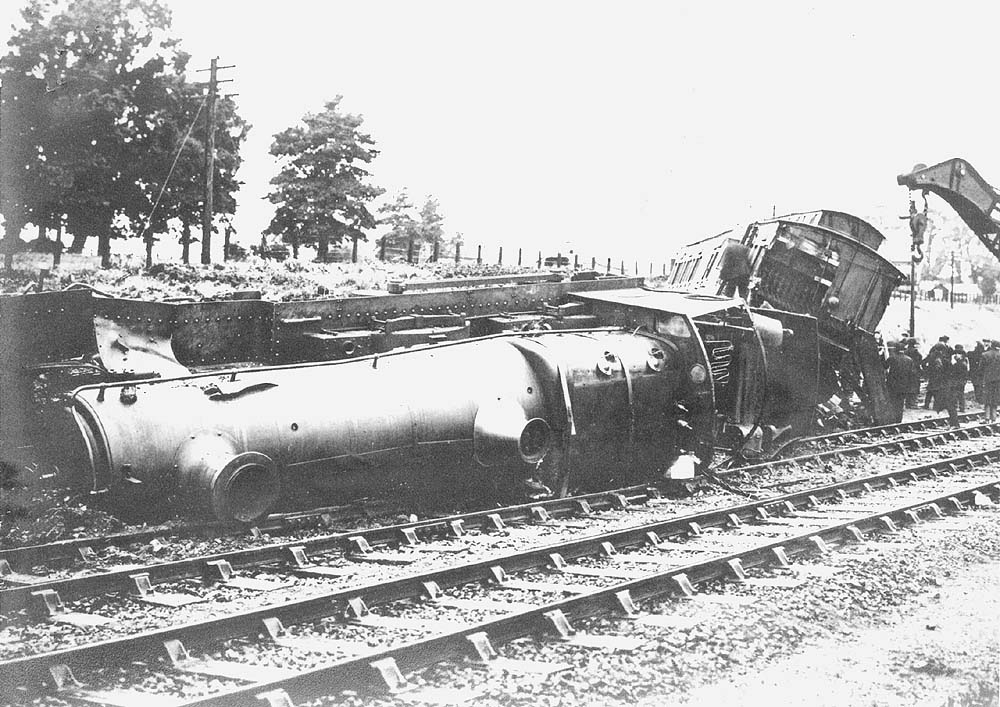 Another view of the derailed Atbara class locomotive and the coaching stock being attended by Tyseley shed's breakdown crane