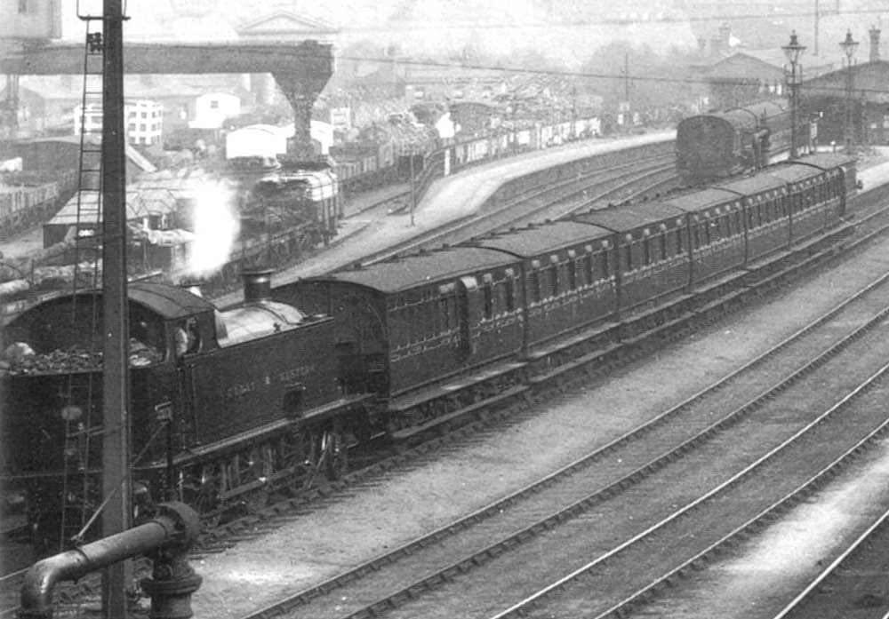 Close up showing an unidentified GWR 2-6-2T Prairie locomotive running bunker first from platform 3 at Hockley station