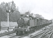 GWR 2-8-0 No 7247 is seen at the head of a Class H through freight service as it approaches Lapworth on the Up Main line