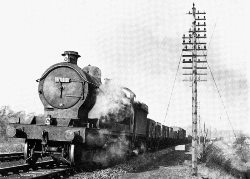 Ex-Great Western Railway 2-8-0 30xx class ROD No 3012 with a northbound class H unfitted through freight south of Lapworth on Sunday 4th December 1955