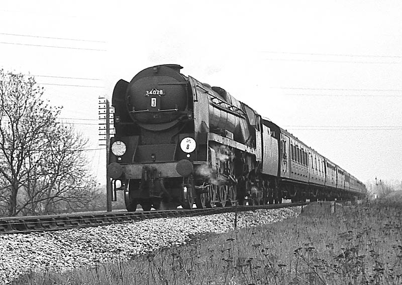 Ex-SR 4-6-2 West Country class No 34028 'Eddystone' heads a football special near Lapworth on 27th April 1963