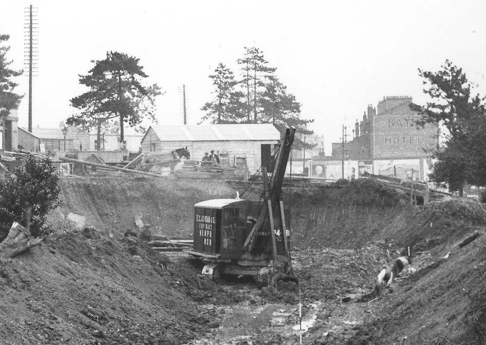Close up showing a Ruston Bucyrus face shovel excavating the basement of the new building and forecourt
