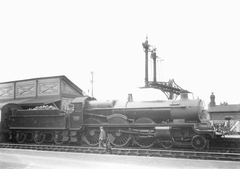 GWR 4-6-0 40xx 'Star' class No 4050 'Princess Alice' pauses at the up platform for the driver to check the locomotive