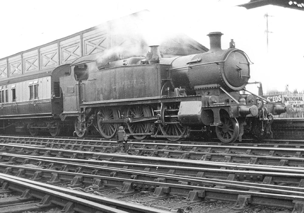 GWR 2-6-2T 31xx class No 5118 rests at the head of a Birmingham service with a rake of 70' 'Toplight' coaching stock behind its bunker