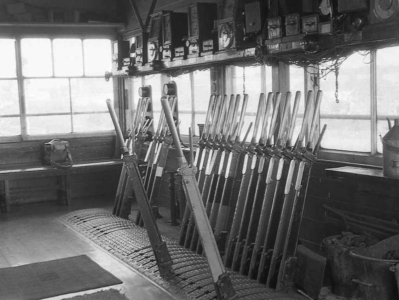 One of three views of the interior of the operating floor at Queens Head Signal Box showing part of the three bar, vertical tappet frame