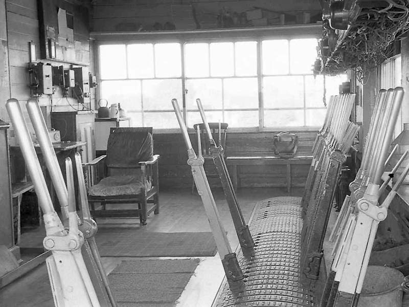 Another view showing the spartan interior of Queens Head Signal Box, with the telephone equipment on the back wall