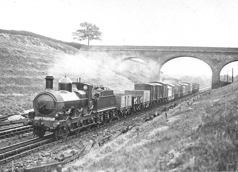 GWR 0-6-0 322 class locomotive No 354 heads a northbound local freight train over the Rowington troughs circa 1925