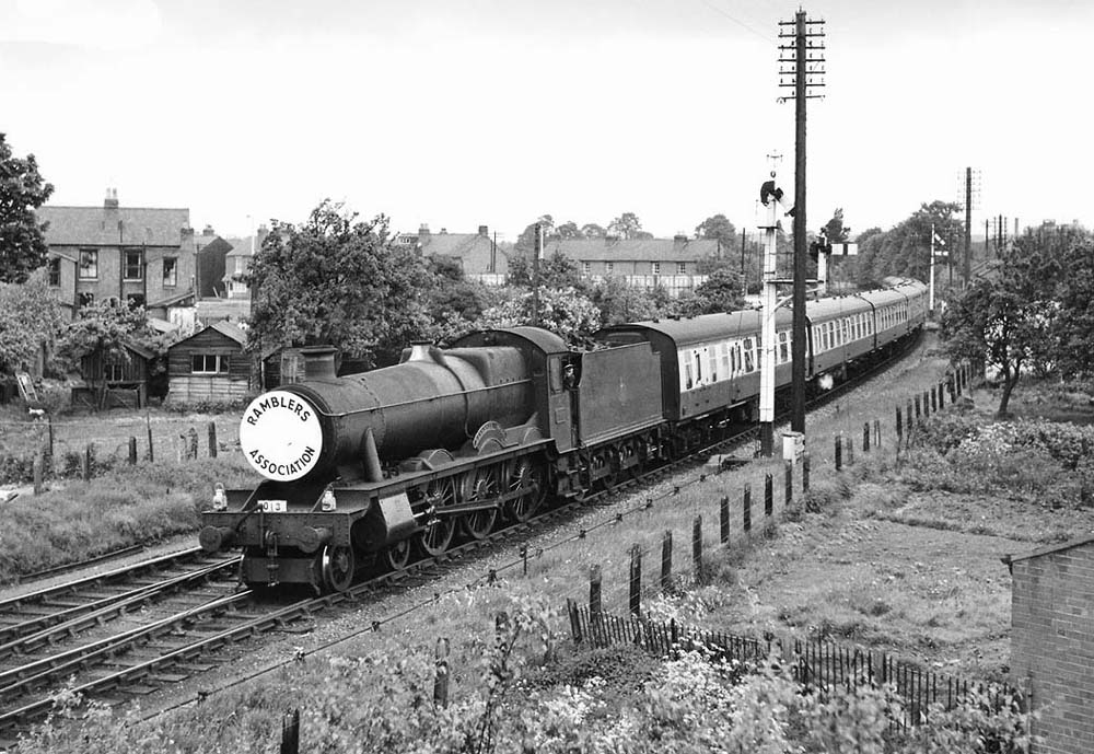 British Railways built 4-6-0 Modified Hall No 7908 'Henshall Hall' approaches Sanctus Road bridge with a Ramblers Association special on 18th May 1958