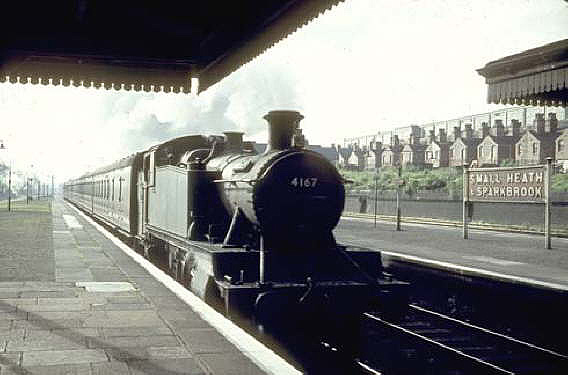 GWR 2-6-2T No 4167, a class 51xx 'Large Prairie' locomotive, is seen arriving at Small Heath's main down platform on a Leamington to Snow Hill service