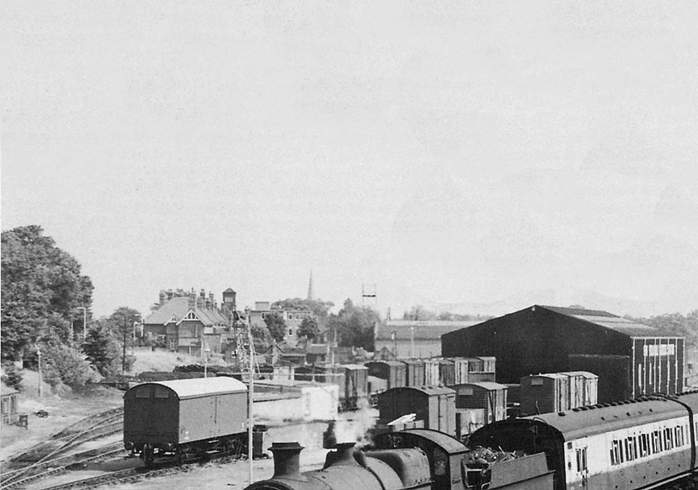 Close up of Solihull's goods yard and shed with a four-wheel motor van buffered up to the landing dock on 10th August 1957