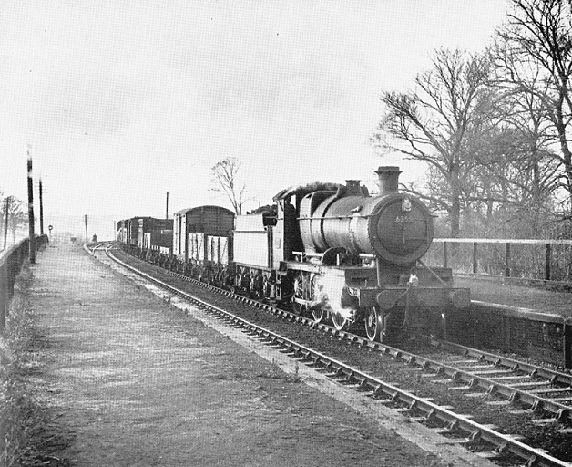Ex-Great Western Railway 2-6-0 43xx class mogul No 6359 passes a desolate Stratford-on-Avon Racecourse Platform in January 1959