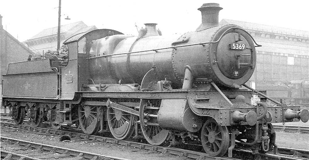 GWR 2-6-0 No 5369, a class 43xx locomotive, is seen coming off Tyseley shed with Tyseley Repair Shops in the background