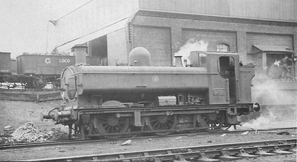 GWR 0-6-0PT No 9750, a class 57xx full-cab locomotive, is seen in steam in front of Tyseley's two-road coaling shed