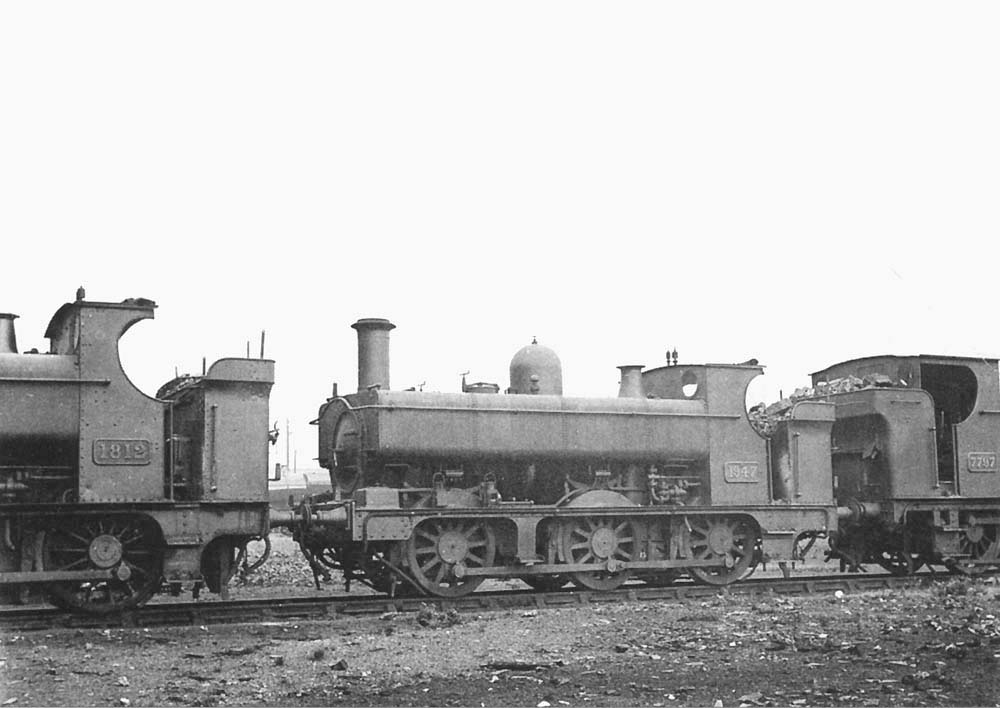 GWR 0-6-0PT Pannier Tank No 1947 is seen buffered up in line with two other Panniers, No 1812 on the left and No 7797 on the right in 1930