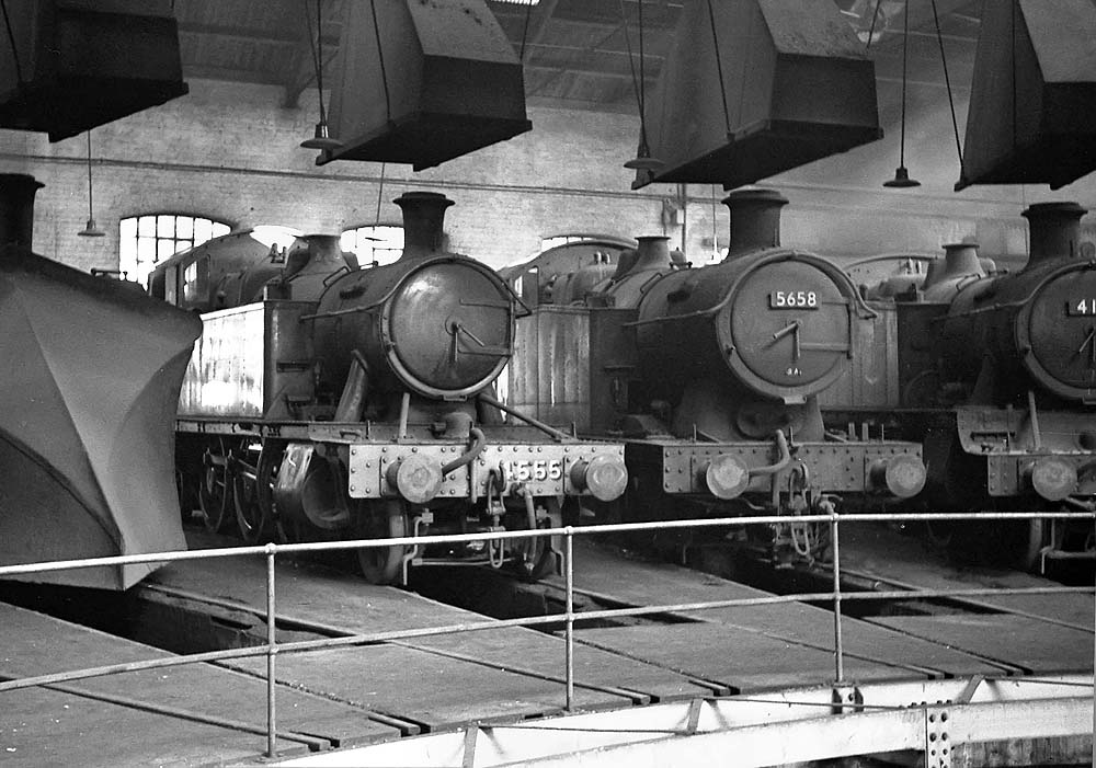 Ex-GWR 2-6-2T No 4555, in newly refurbished GWR livery, and ex-GWR 0-6-2T No 5658 are seen with other locomotives on 31st January 1965