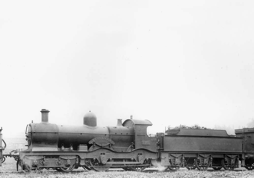 GWR 4-4-0 No 3253 'Boscawen', a curved outside-framed Duke class locomotive, is seen simmering in steam waiting for its next trip