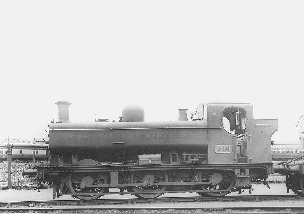GWR 0-6-0PT No 7758, a class 57xx full-cab locomotive, is seen on shed with the carriage sidings in the background in June 1934