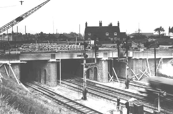 Looking across the railway to Stockfield Road bridge as construction work on the bridge enters the final phase of completing walls and road surfaces