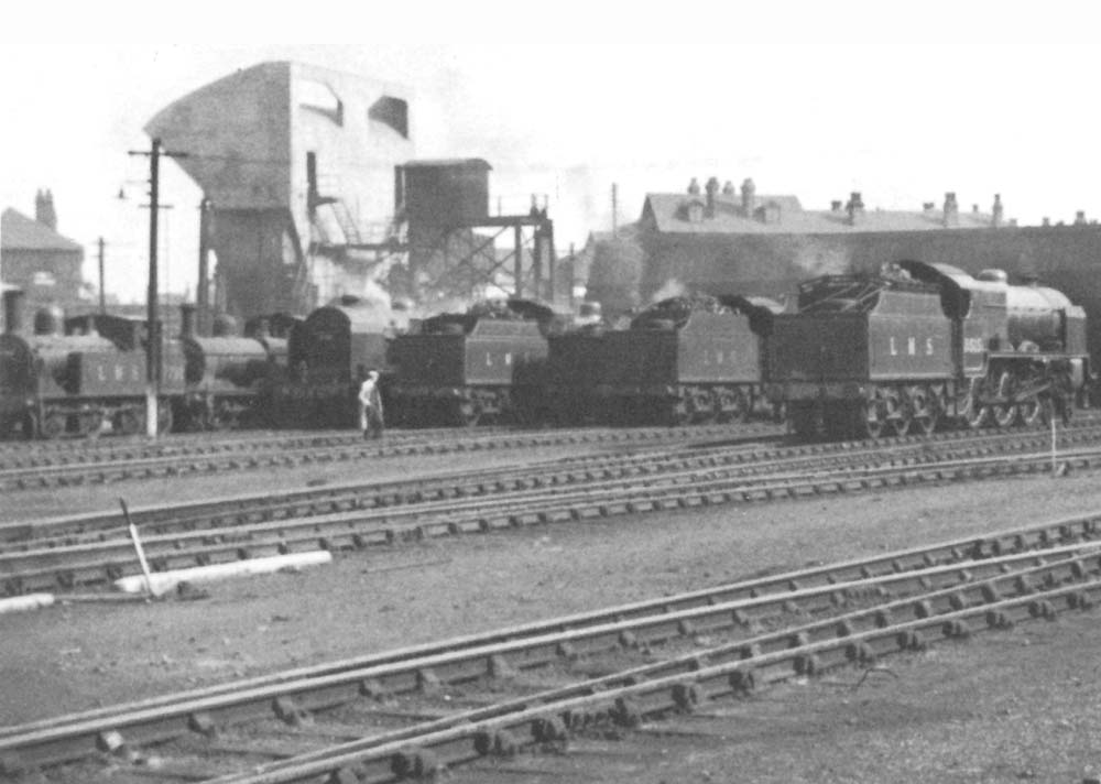 Close up showing two LMS tender passenger locomotives together with LMS and ex-LNWR freight locomotives