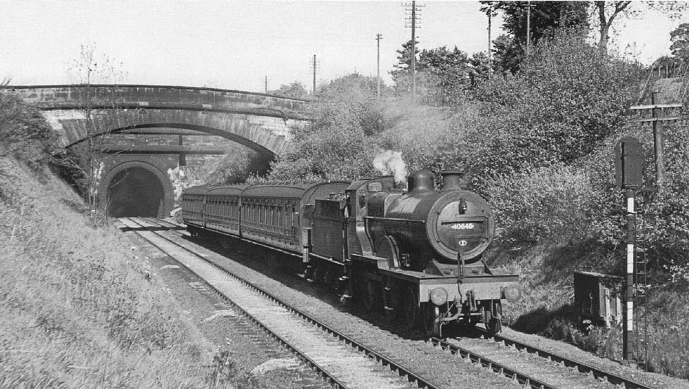Ex-LMS 2P 4-4-0 No 40646 is seen at the head of the 5 25pm Coventry to Birmingham service having just left Beechwood tunnel