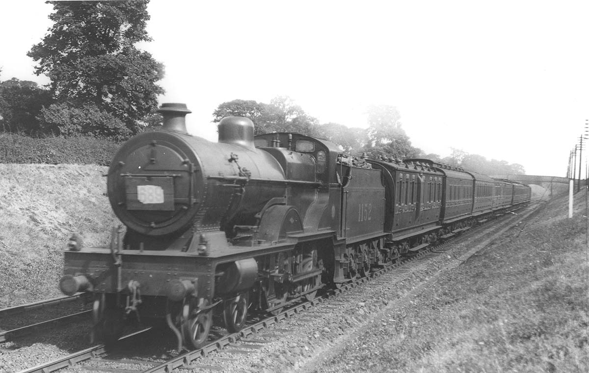 LMS 4P 4-4-0 Compound No 1152 is seen at the head of a Brighton to Birmingham down express near Berkswell on 11th August 1928