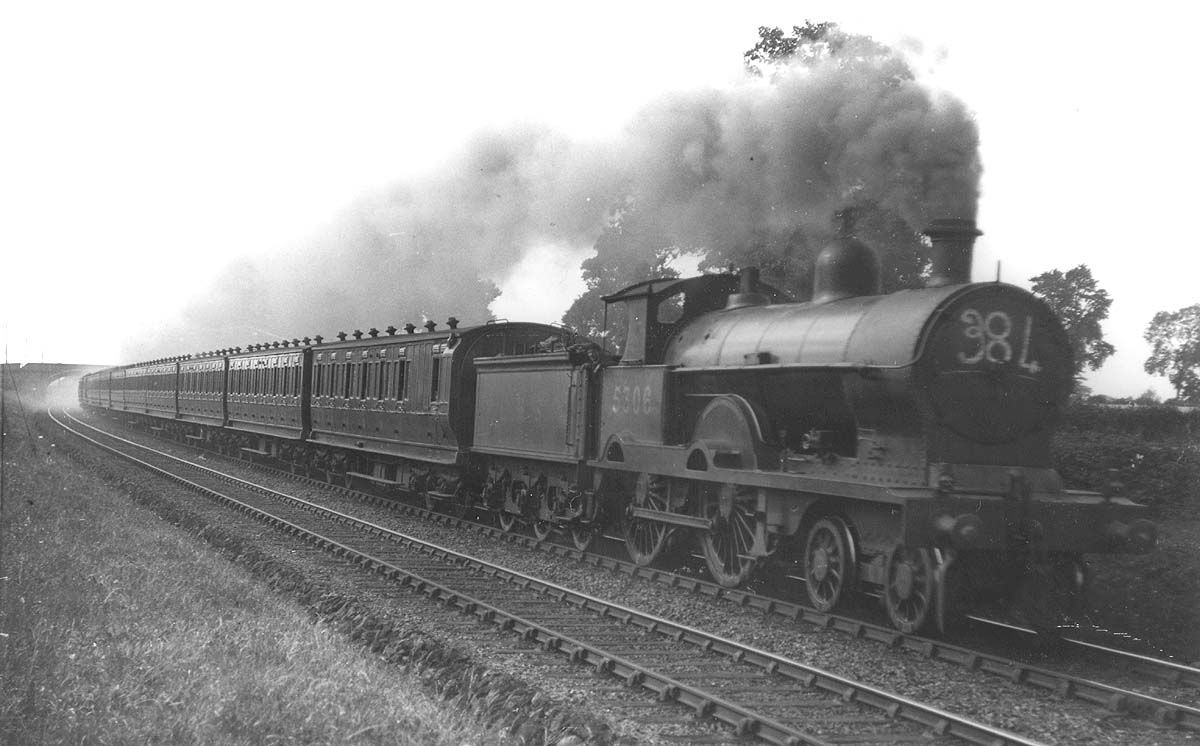 Ex-LNWR 3P 4-4-0 Precursor class No 5306 'Lang Meg' is seen on an up Euston to Blackpool express service north of Berkswell on 11th August 1928
