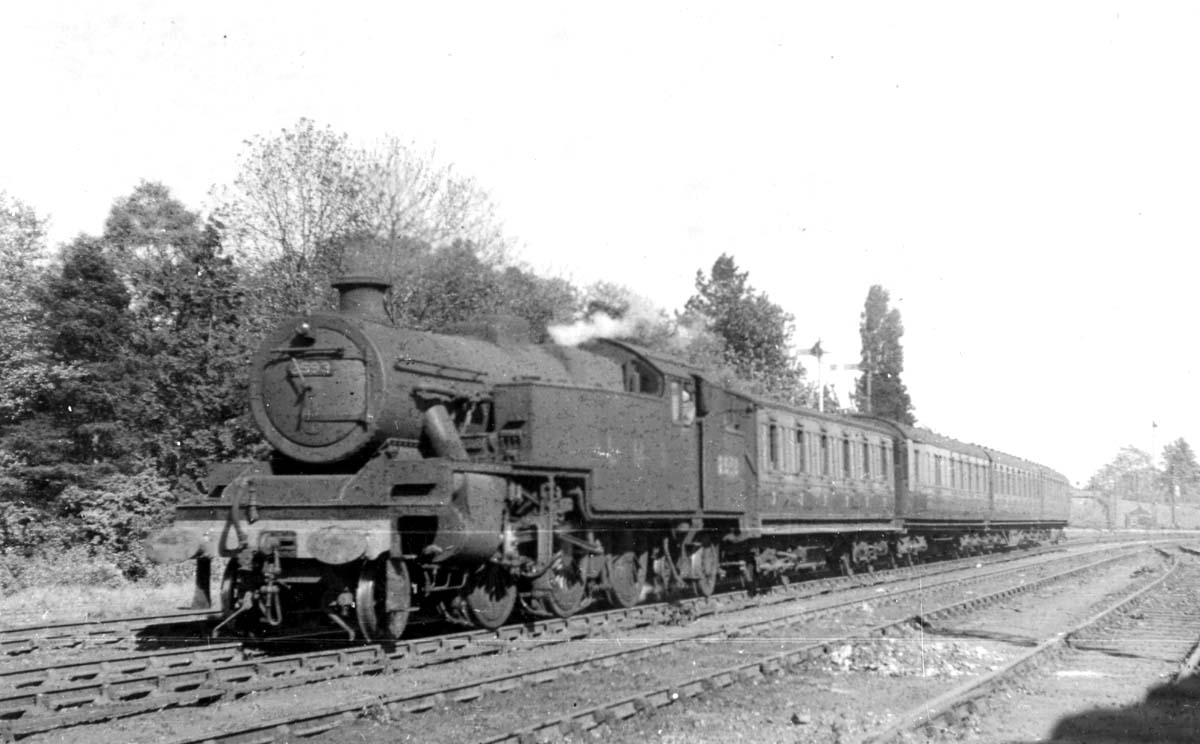 LMS 4MT 2-6-4T No 2593 on a Rugby to Birmingham local passenger train as it passes the junction with the Kenilworth branch