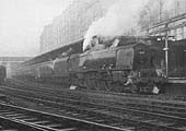 Ex-LMS 7P 4-6-0 Princess Coronation class No 46257 'City of Salford' is seen standing at the East end of Platform 1 with an up express