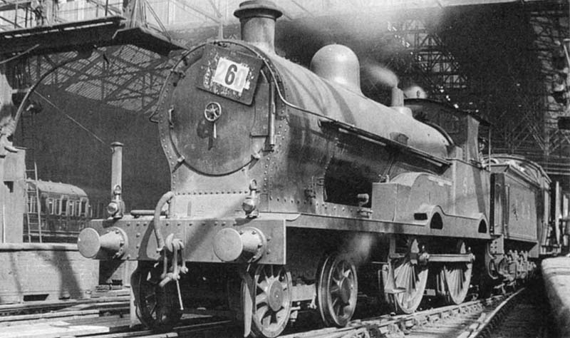 Ex-LNWR 3P 4-4-0 George the Fifth class No 5354 'New Zealand' is seen standing at the West end of Platform 3 at the head of a down excursion to the North
