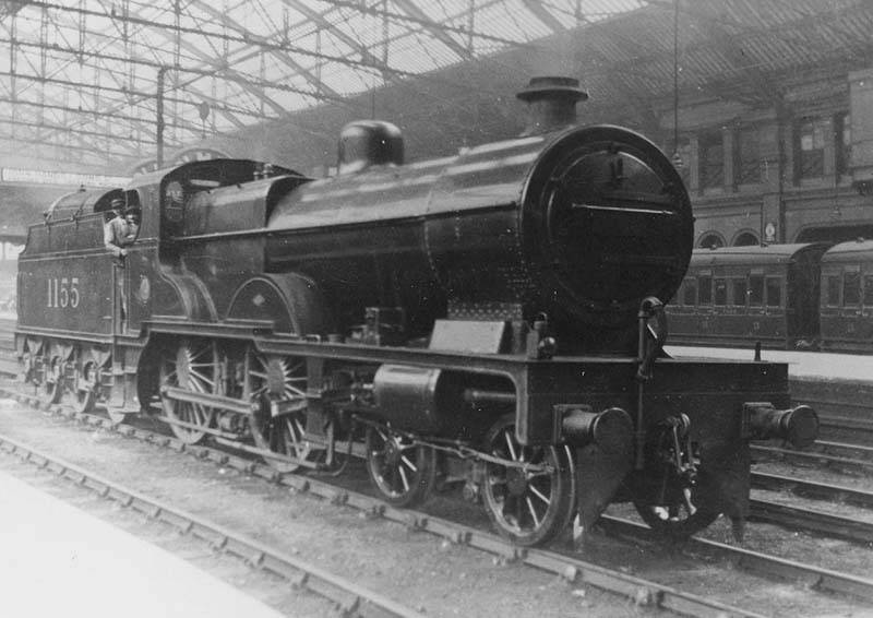 LMS 4P Compound No 1155 is seen light engine standing at the East end of the middle road between Platforms 1 and 2 having been converted for oil firing