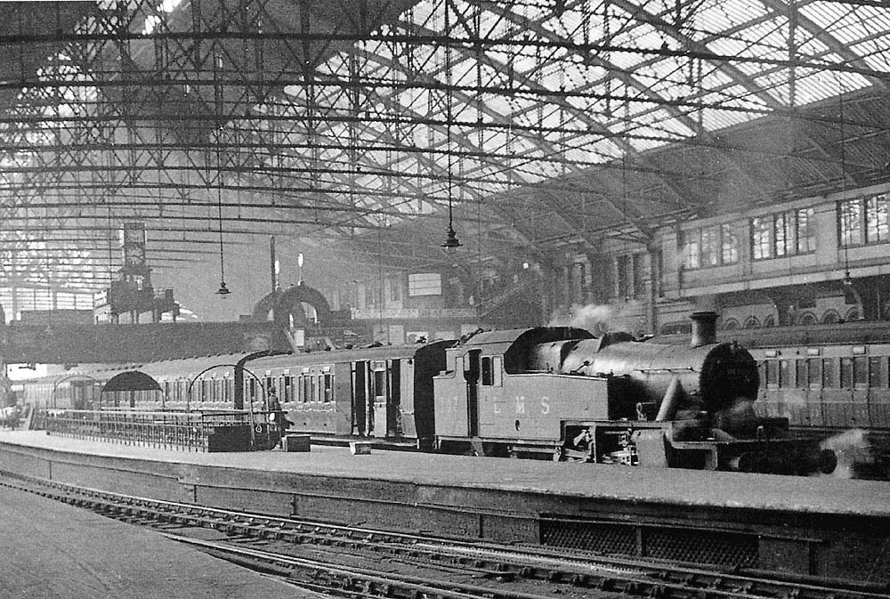 LMS 3MT 2-6-2T No 143 is seen standing at the East end of the up face of Platform 2 at the head of a local passenger service on 5th July 1935