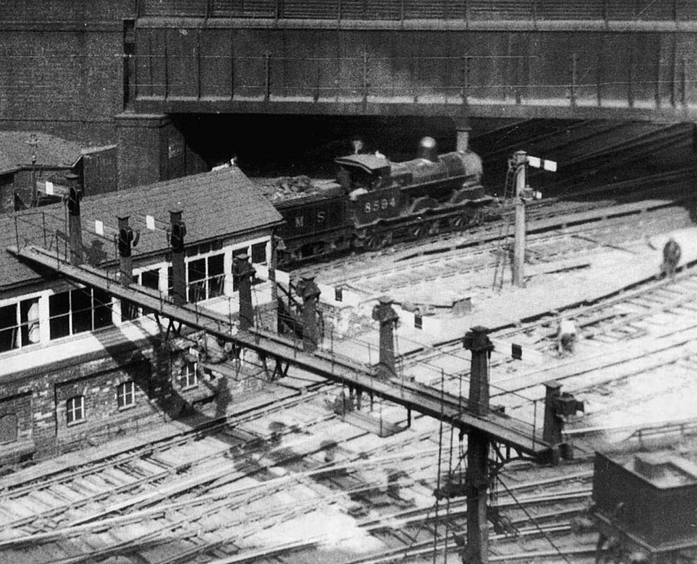 Close up showing the timber signal gantry adjacent to New Street No 5 Signal Box and the  signal controlling access to the tunnel