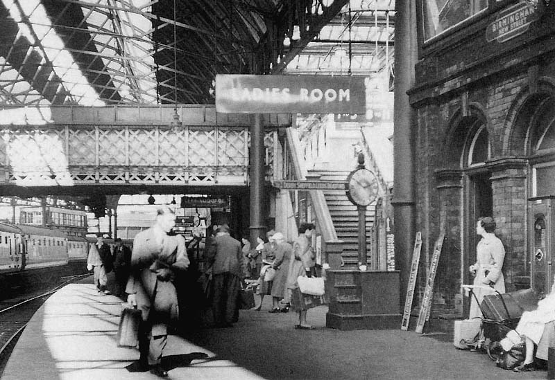 View looking West of the steps leading off Platform 7 up to the pedestrian footbridge in 1954