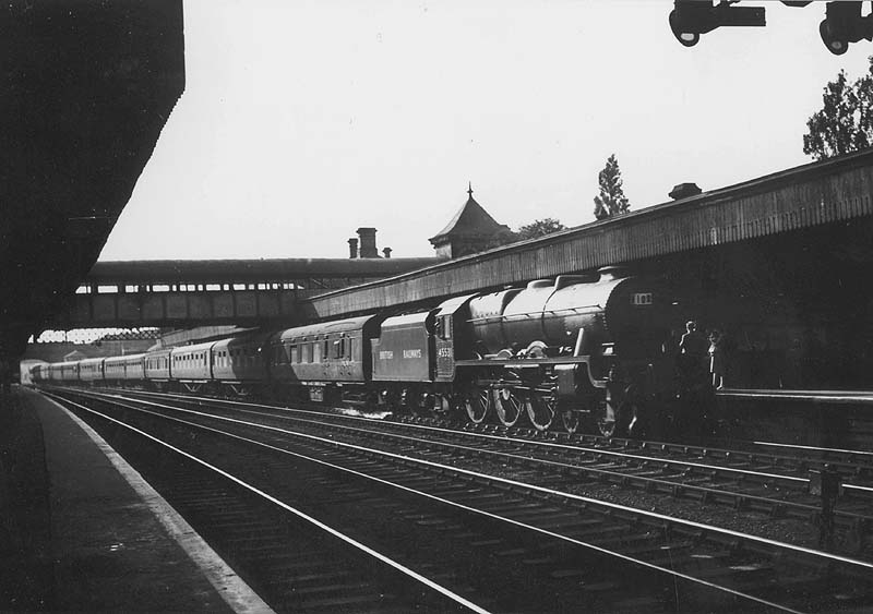 Ex-LMS 4-6-0 6P rebuilt Patriot class No 45531 'Sir Frederick Harrison' is seen arriving at Coventry's up platform with a twelve-coach up express