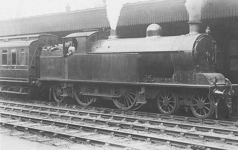 Ex-LNWR 4-4-2T Precursor tank No 6794 is seen standing at platform one with an ex-Midland Railway clerestory coach behind the bunker
