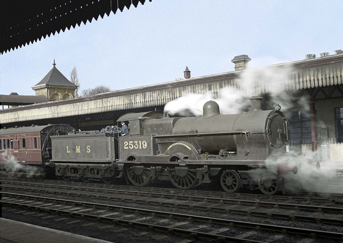 Ex-LNWR 3P 4-4-0 Precursor class No 25319 'Bucephalus' is seen standing at platform one on an up local passenger service