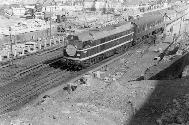 View of Diesel No D5574 at the head of a promotional special train standing at the down platform during rebuilding