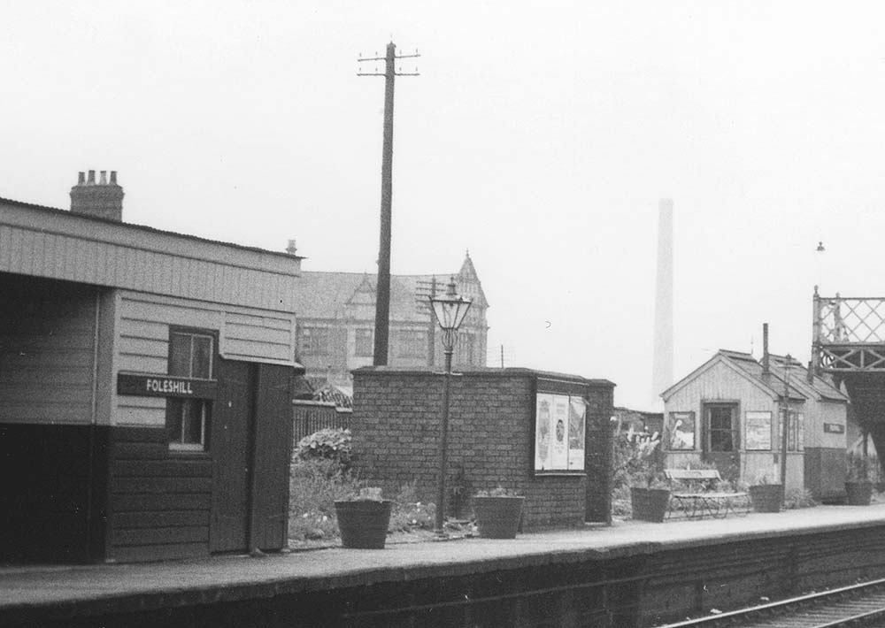 Close up of Foleshill station's up platform passenger shelter with news agent kiosk, brick built gentlemen's toilets and two timber huts